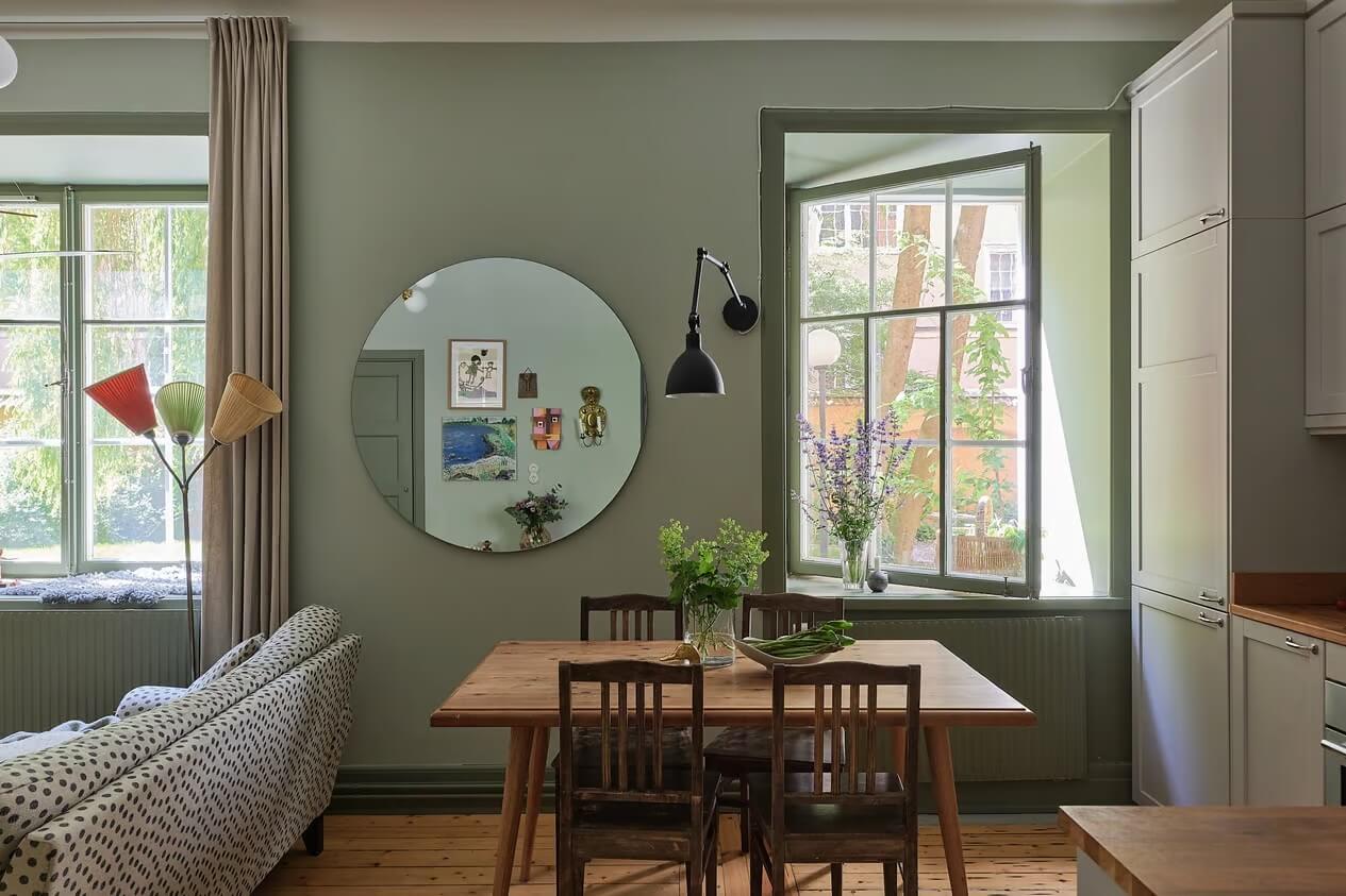 Soothing Colors and Smart Solutions in a Two Bedroom Apartment 6 dining table with round mirror