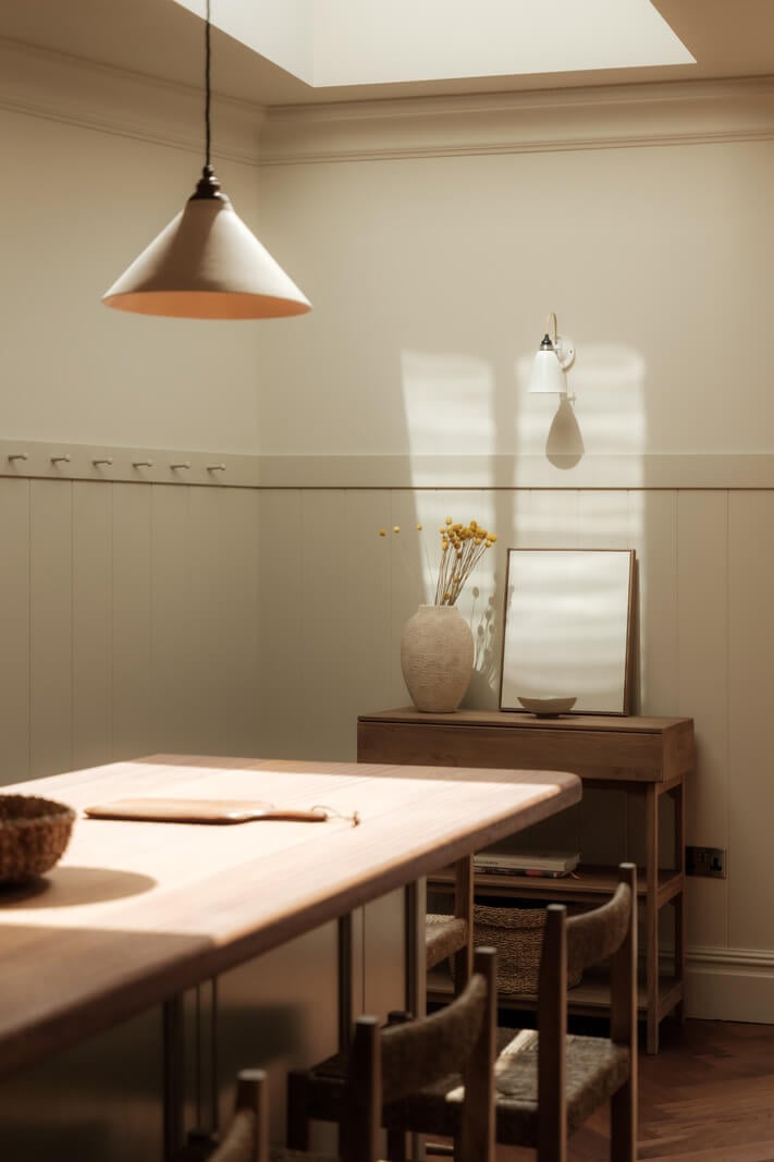 A Calm Color Palette and Warm Materials in a London Home 12 dining table with skylight