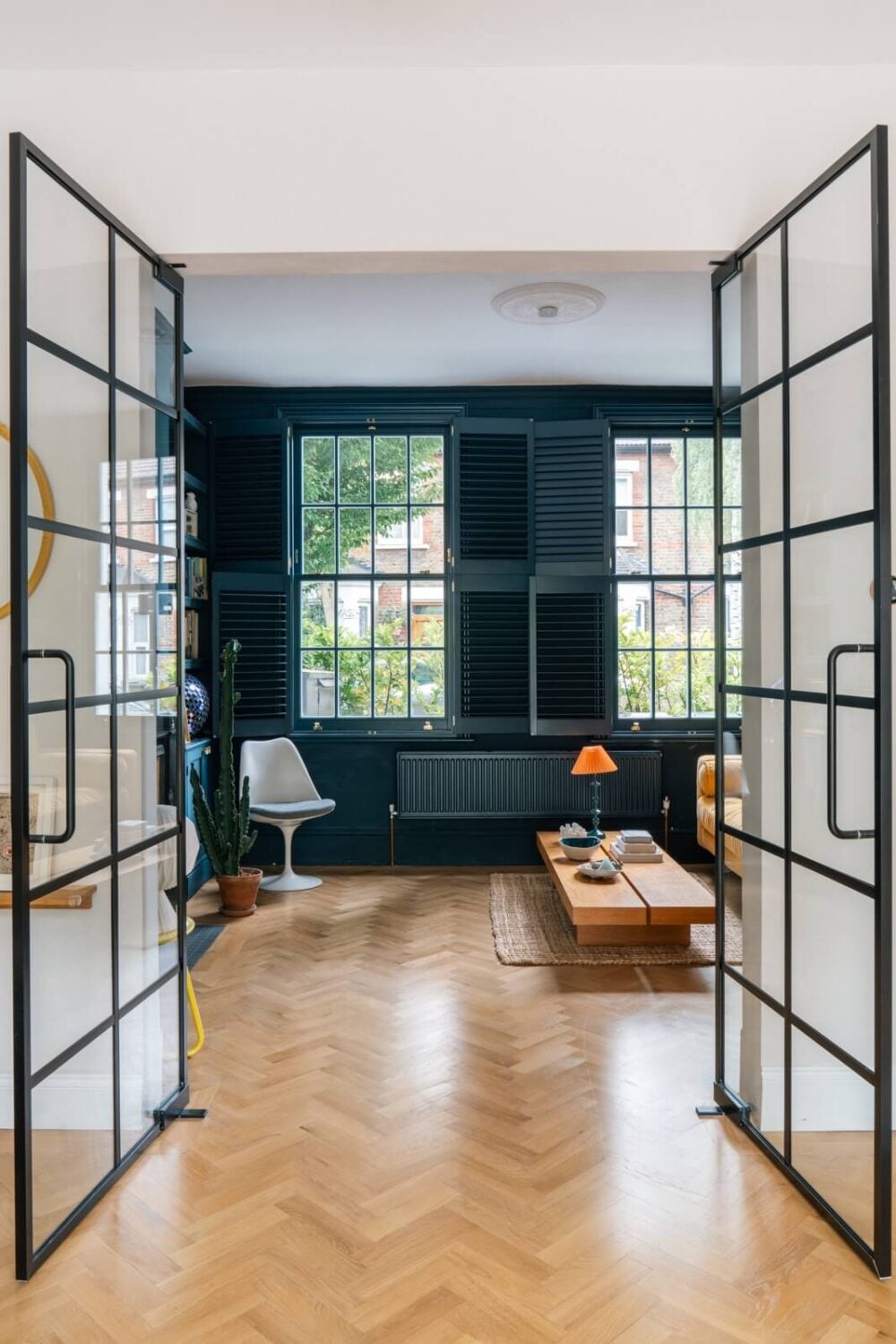 A Dark Blue Living Room in a Historic London Home 4 double glass doors to blue living room