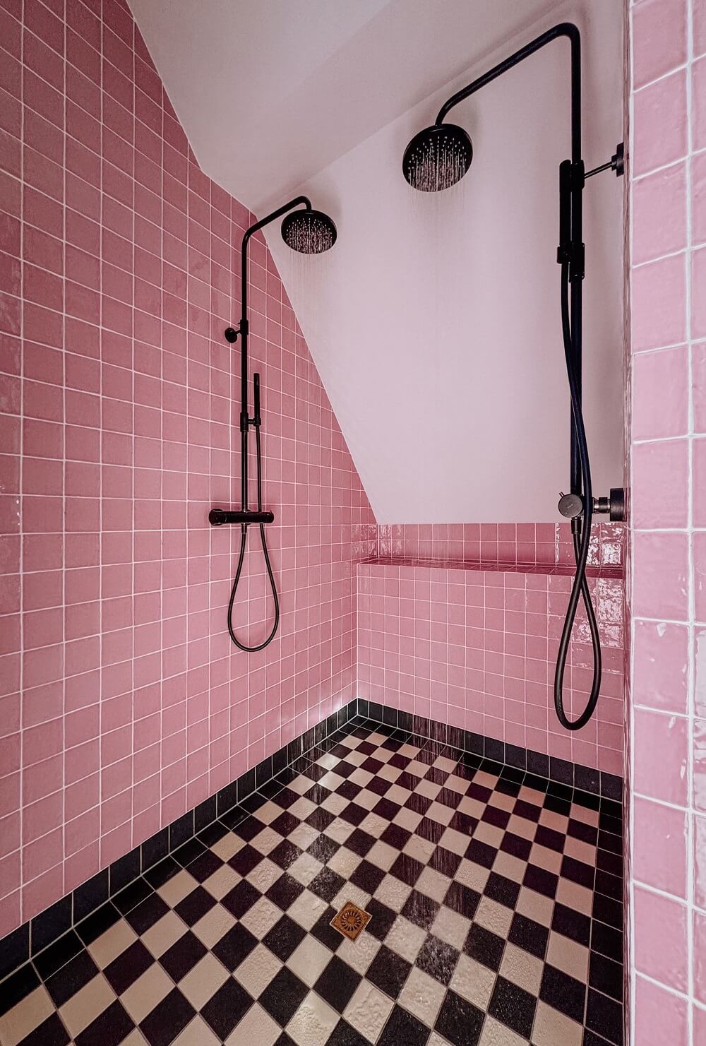 Best of 2024: Bathrooms 17 double shower with pink tiles and checkerboard floor nordroom