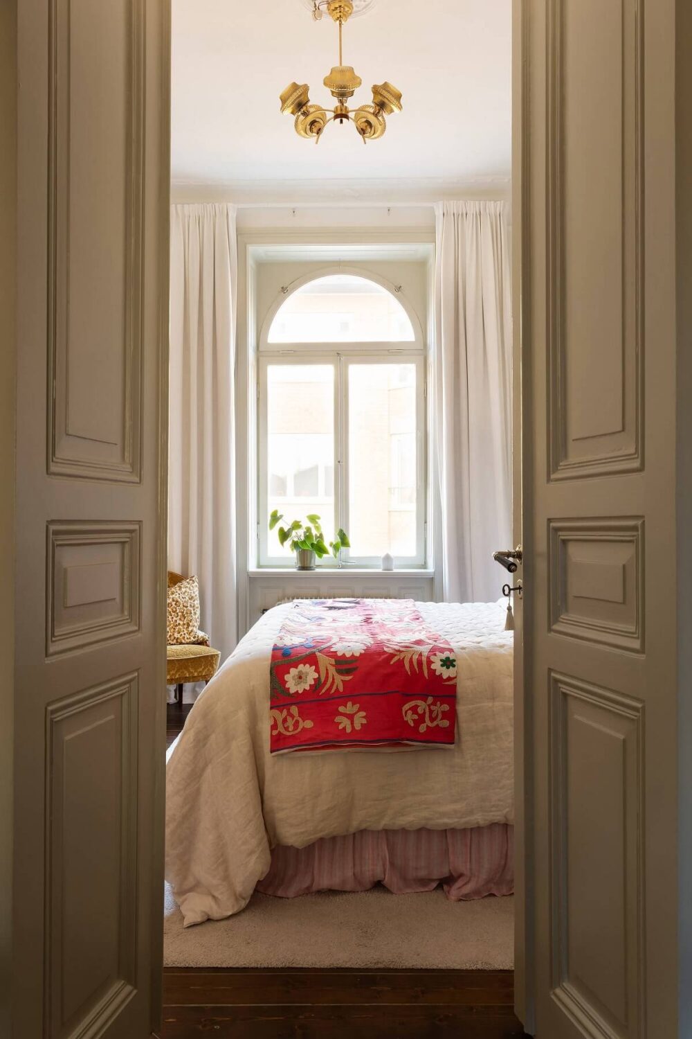 A Beautiful Turn-of-the-Century Apartment with Bold Color Accents 21 double wooden doors bedroom