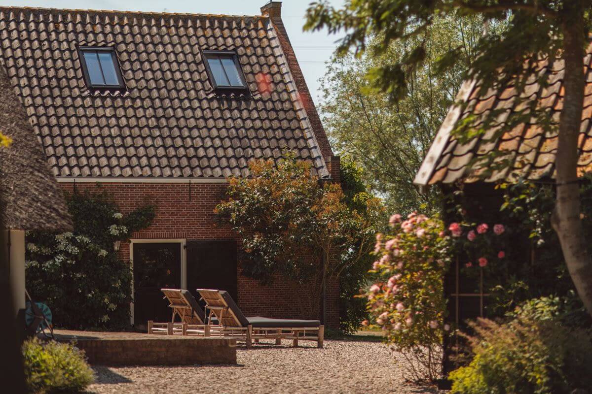 An Eclectic Colorful House in an Old Dutch Farmhouse 41 dutch farmhouse garden