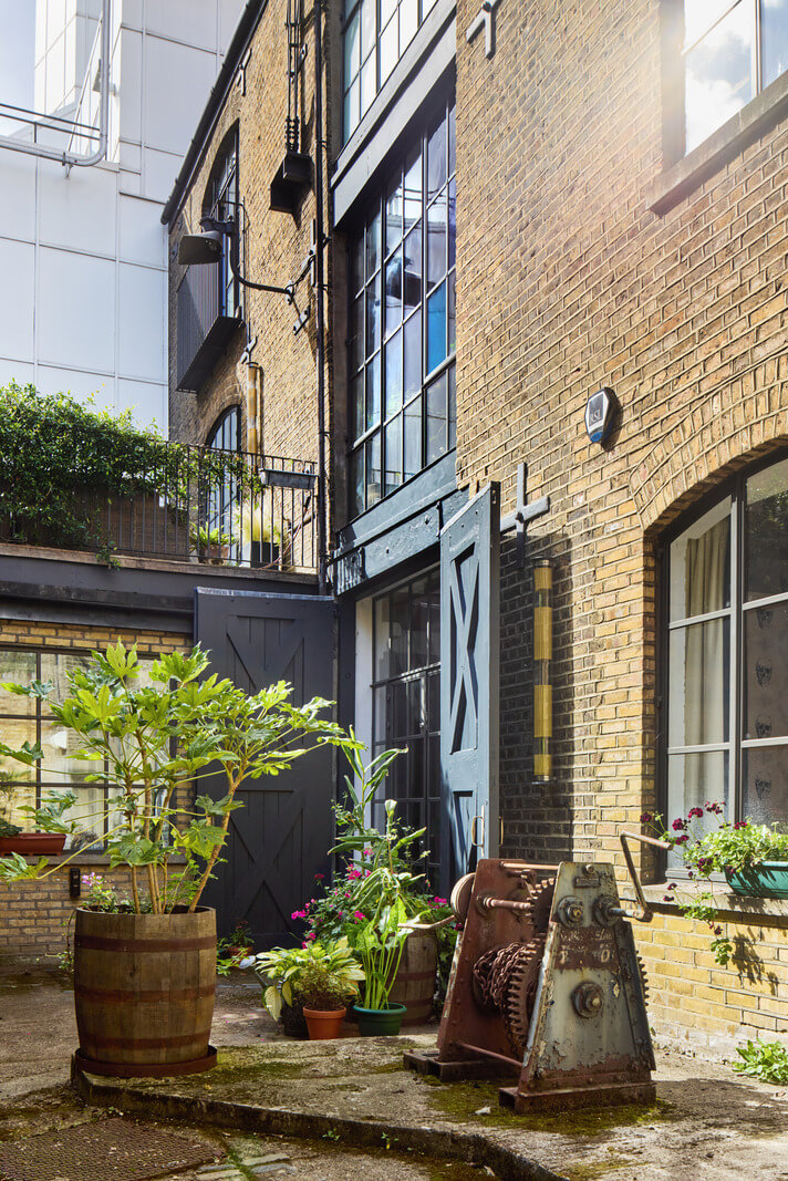 An Industrial and Colorful Warehouse Conversion in London 25 entrance warehouse conversion london