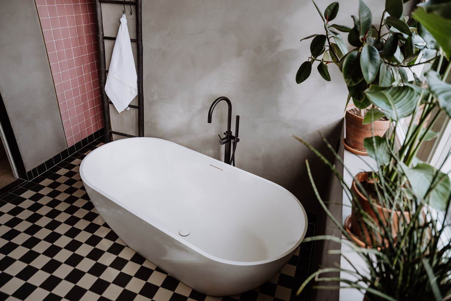 Historic Charm in a New Country House in The Netherlands 22 freestanding bath with checkerboard floor