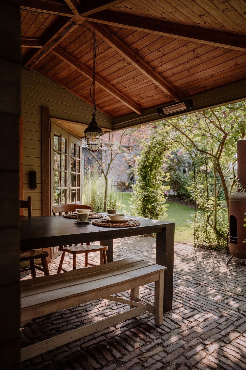 Historic Charm in a New Country House in The Netherlands 27 garden dining space