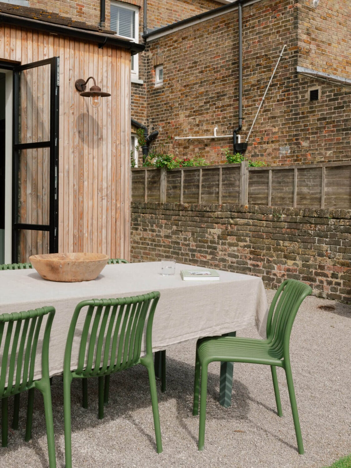 An English House with Carefully Restored Period Features 20 garden dining table green chairs