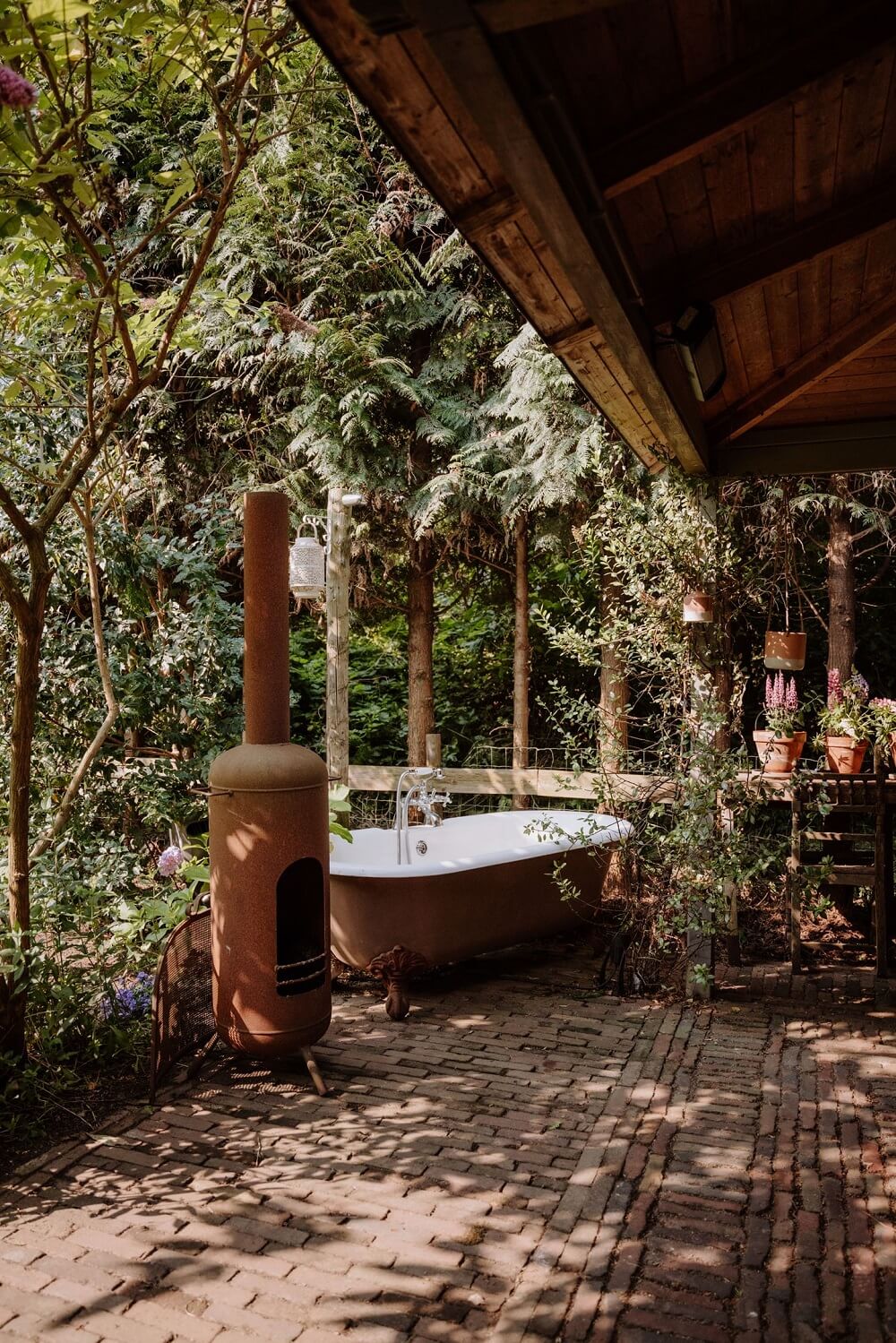 Historic Charm in a New Country House in The Netherlands 26 garden freestanding bath
