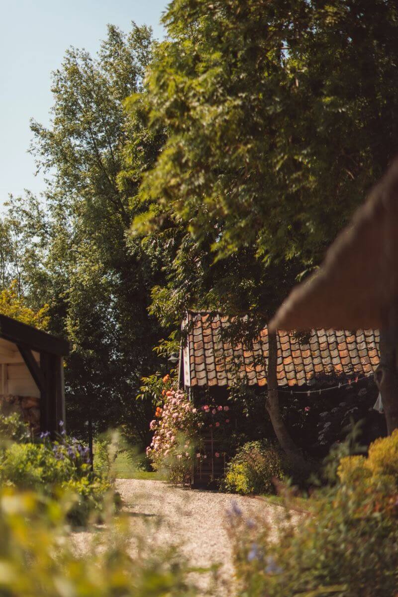 An Eclectic Colorful House in an Old Dutch Farmhouse 39 garden large trees old farmhouse