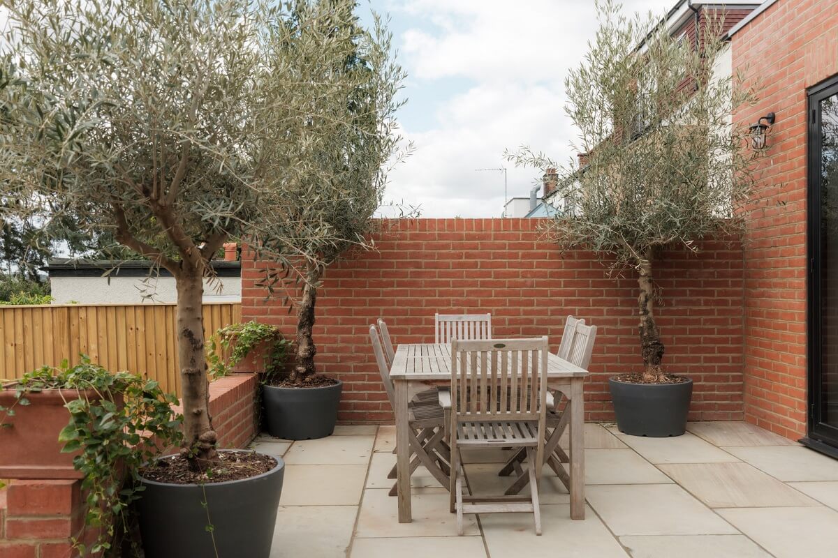 A Calm Color Palette and Warm Materials in a London Home 27 garden terrace