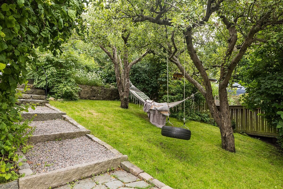 A Lovely Early 20th Century House with Wallpapers 22 garden with hammock