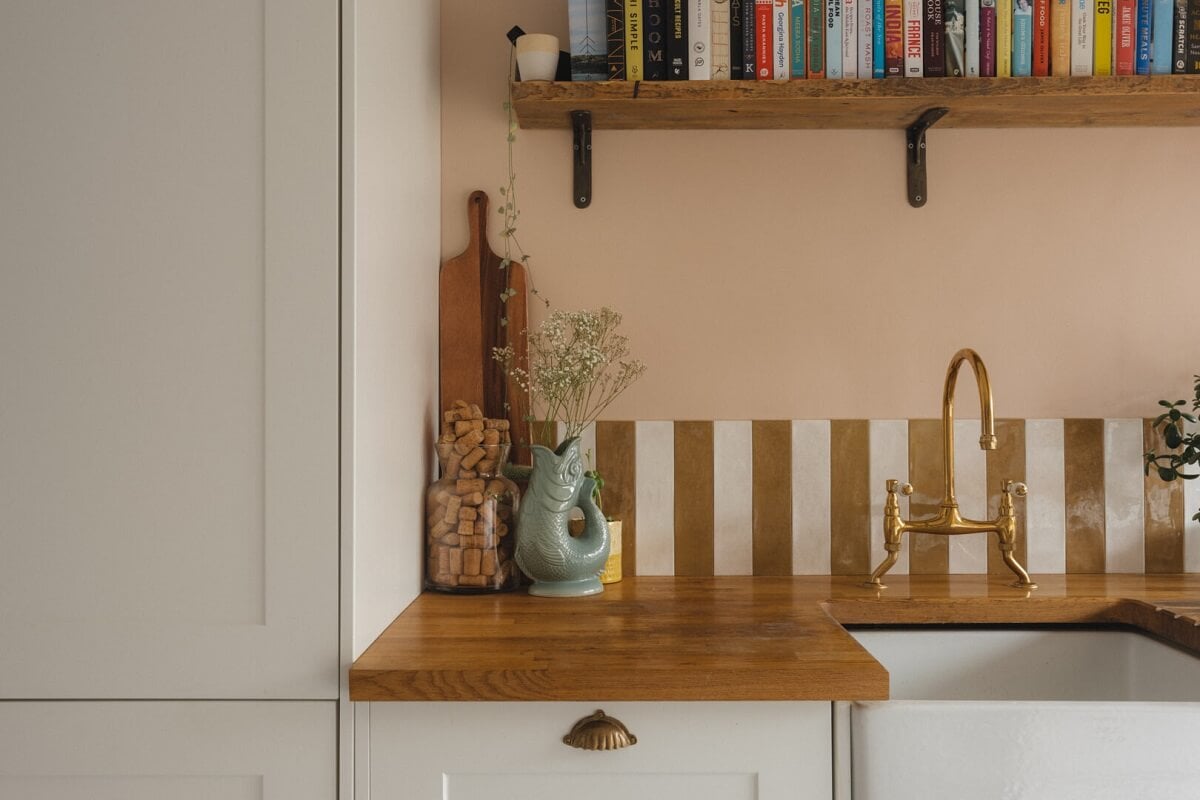 A Charming Victorian House with a Lovely Kitchen 3 gold white striped backsplash