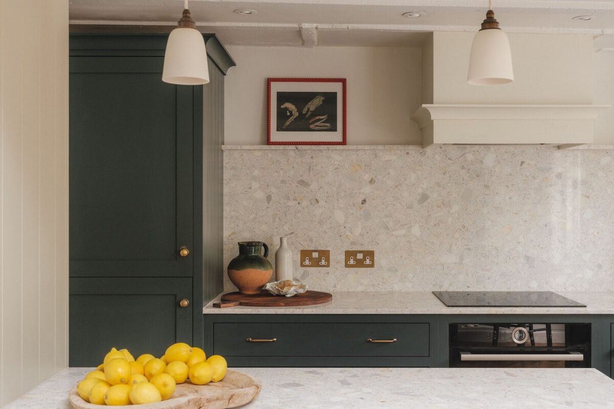 A Soft and Natural Color Palette in a Victorian Home 4 green kitchen with brass fitting