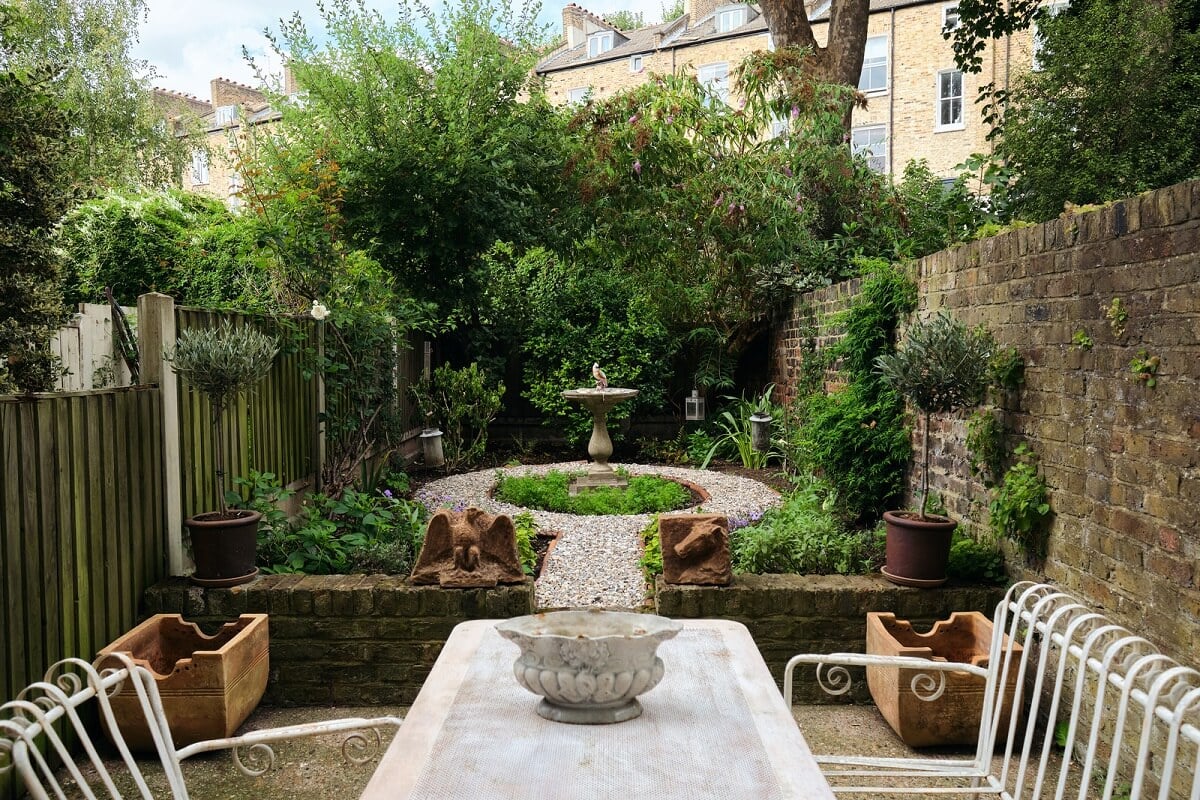 A One-Bedroom Maisonette with a Garden in London 15 green private garden