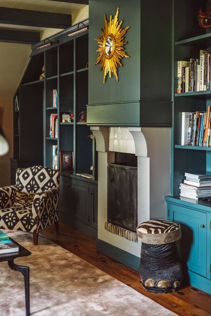 An Eclectic Colorful House in an Old Dutch Farmhouse 6 green sitting room fireplace bookcases