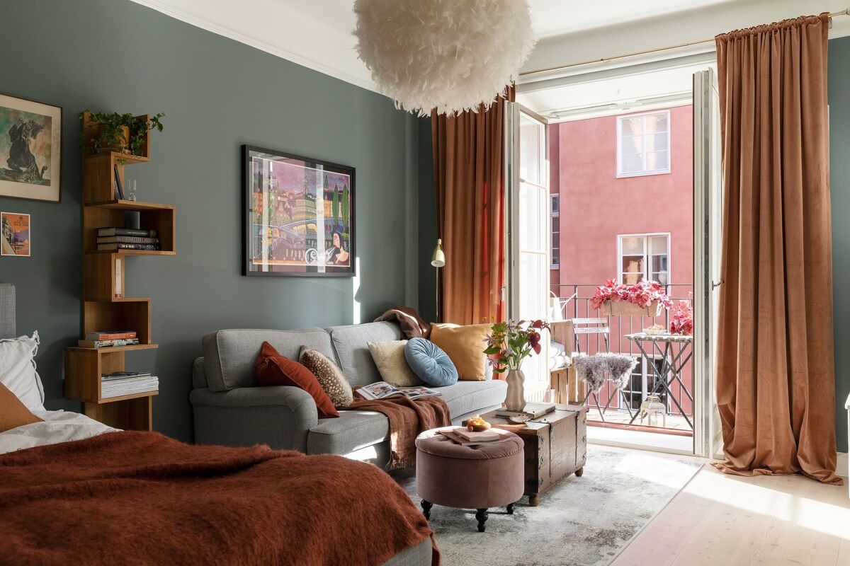 A Stockholm Studio Apartment with Warm Earthy Textiles 1 green studio apartment with balcony and earthy color accents nordroom