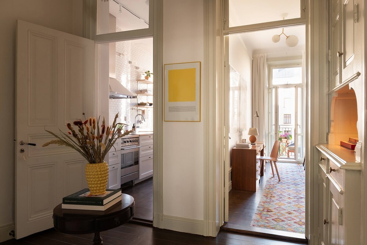 A Beautiful Turn-of-the-Century Apartment with Bold Color Accents 10 hallway view into kitchen and home office
