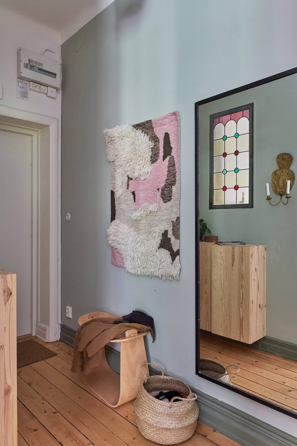 Soothing Colors and Smart Solutions in a Two Bedroom Apartment 19 hallway with large mirror