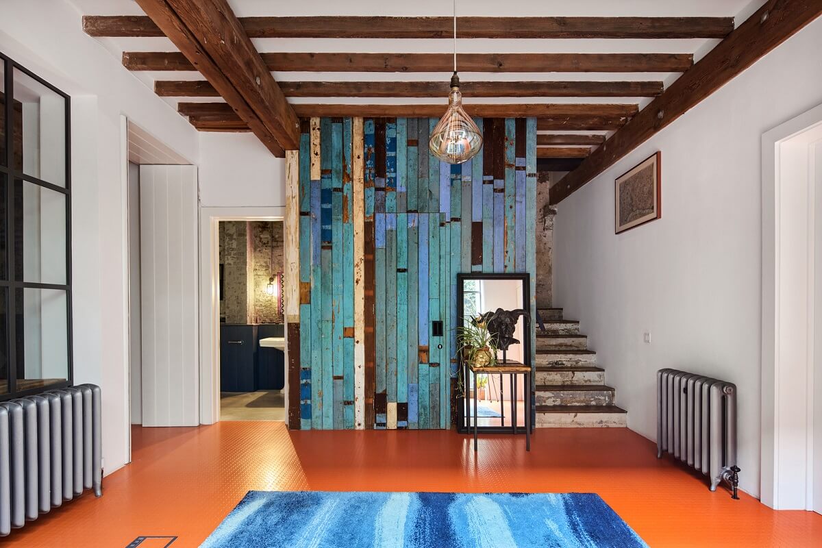 An Industrial and Colorful Warehouse Conversion in London 11 hallway with orange floor