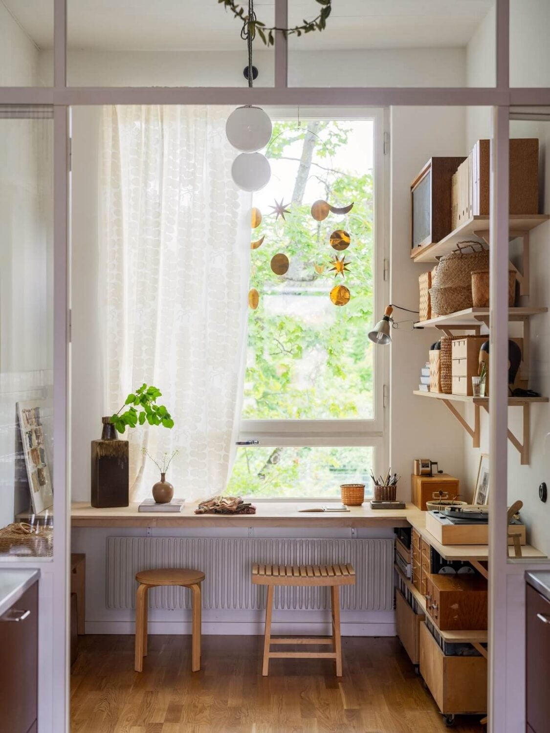 A Scandinavian Family Apartment with a Rusty Red Kitchen 14 home office with desk under window