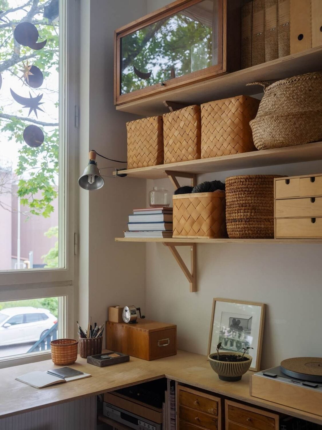 A Scandinavian Family Apartment with a Rusty Red Kitchen 15 home office with shelves and baskets