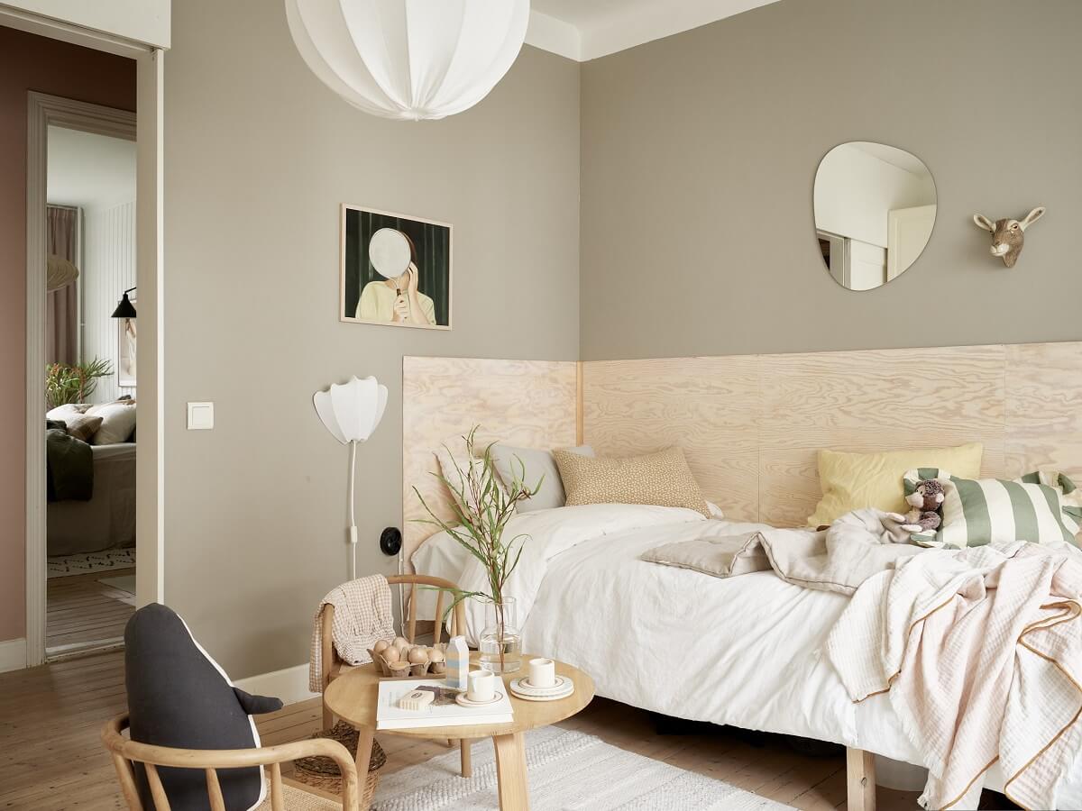 A Swedish Apartment with a Dark Blue Living Room and Exposed Brick 19 kids bedroom with custom plywood bed