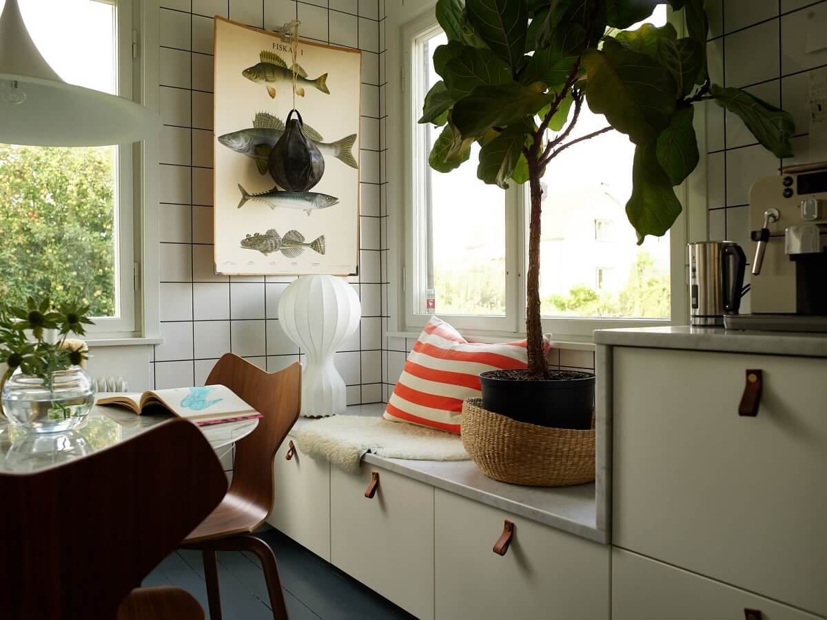 A 1940s House with Painted Floorboards in Sweden 9 kitchen cabinets with window bench