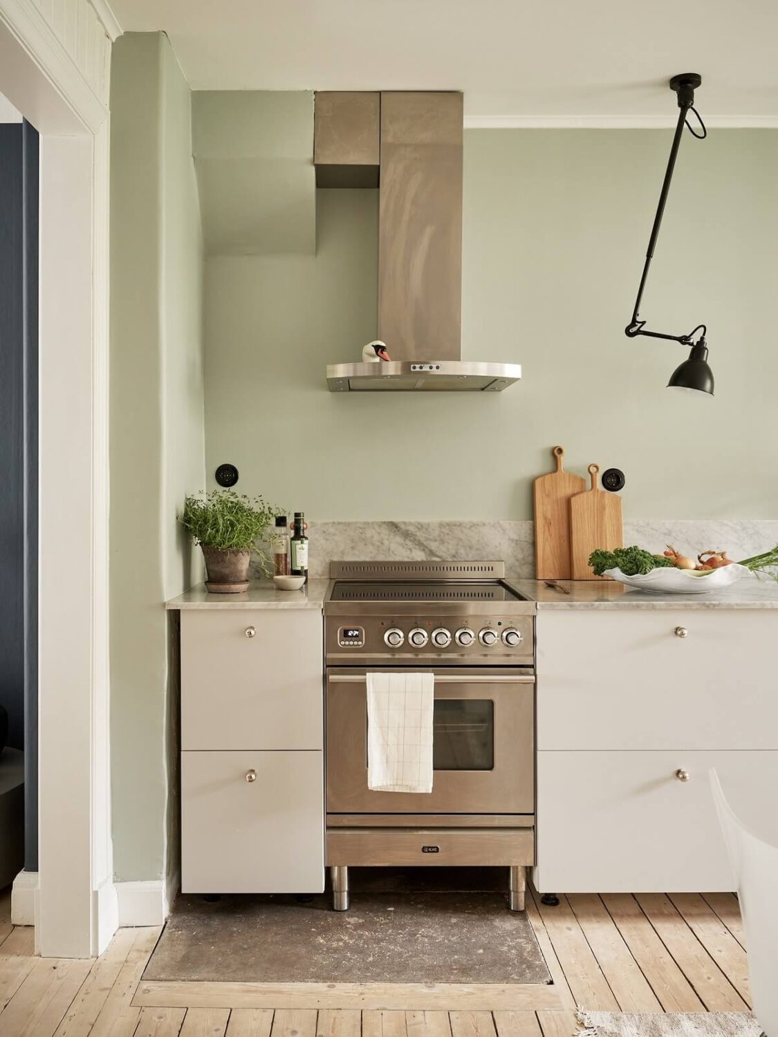 A Swedish Apartment with a Dark Blue Living Room and Exposed Brick 9 kitchen detail
