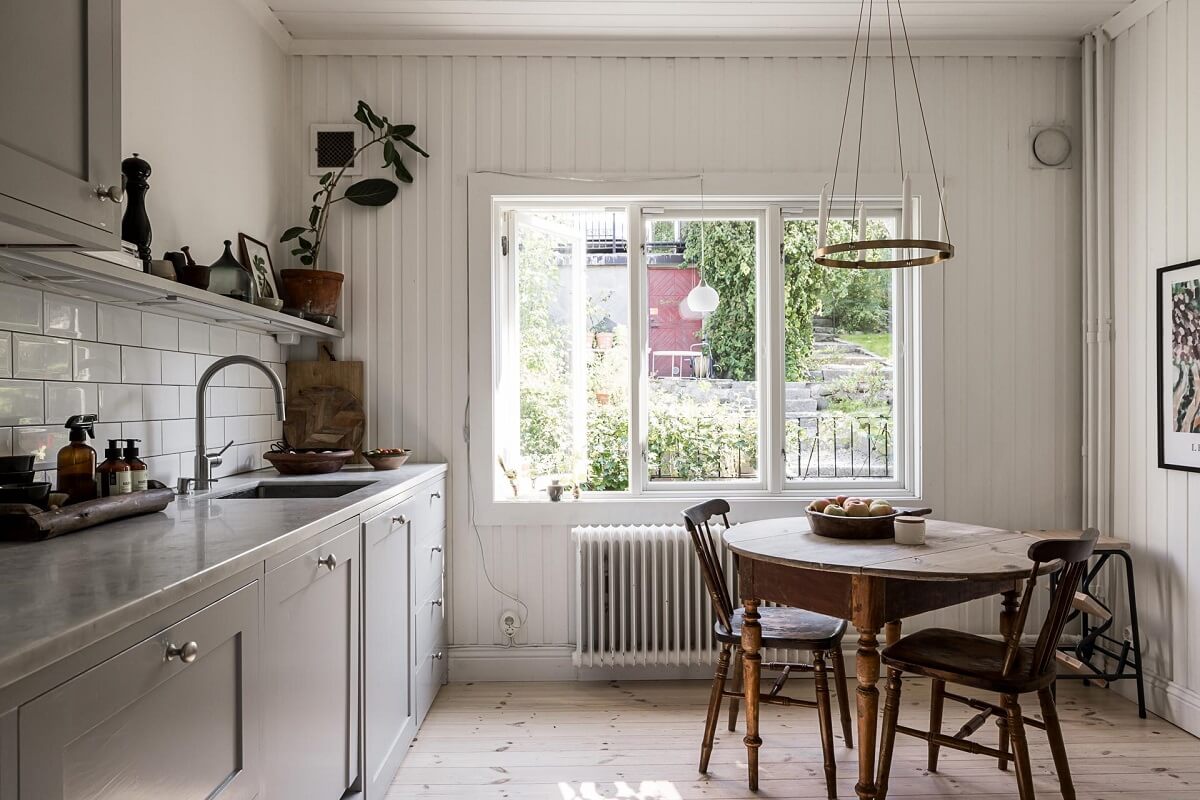 A Lovely Early 20th Century House with Wallpapers 8 kitchen gray cabinets round table