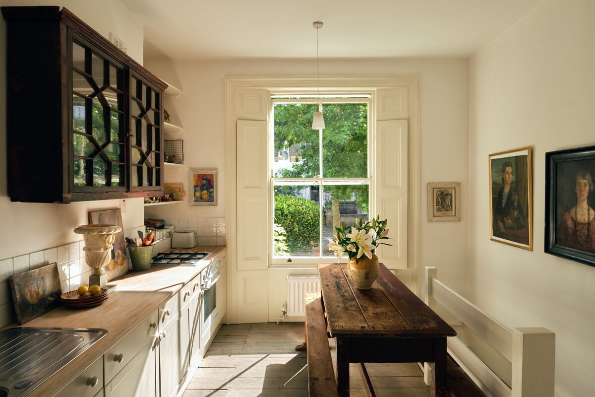 A One-Bedroom Maisonette with a Garden in London 8 kitchen natural light rustic wooden table