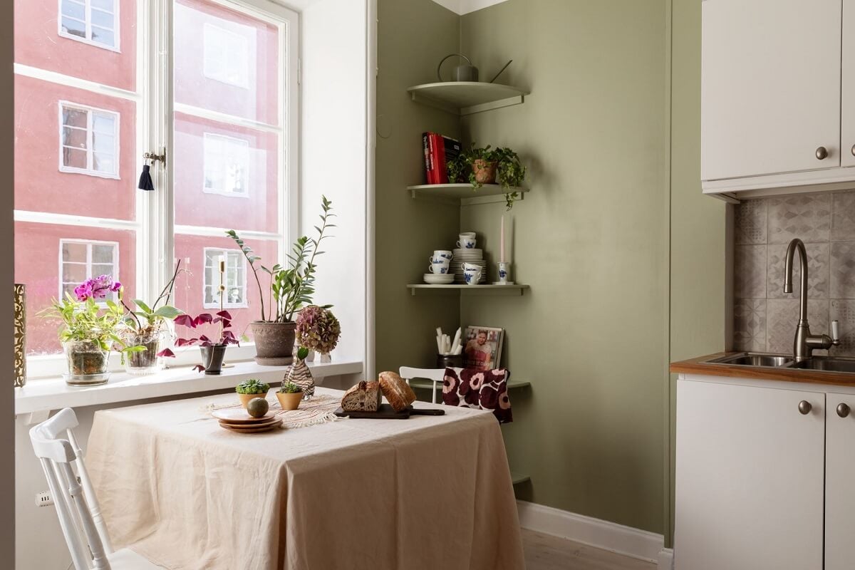 A Stockholm Studio Apartment with Warm Earthy Textiles 15 kitchen table by window