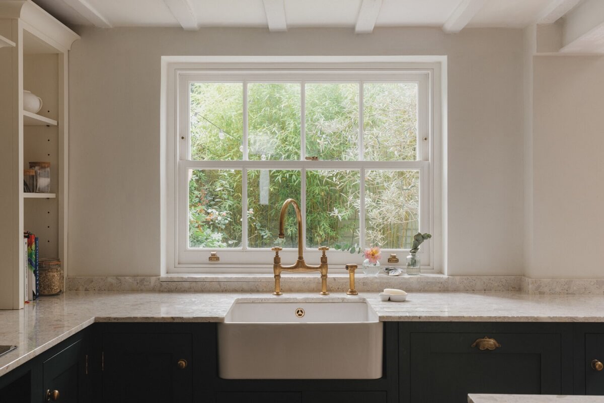 A Soft and Natural Color Palette in a Victorian Home 5 kitchen under windowwith butler sink
