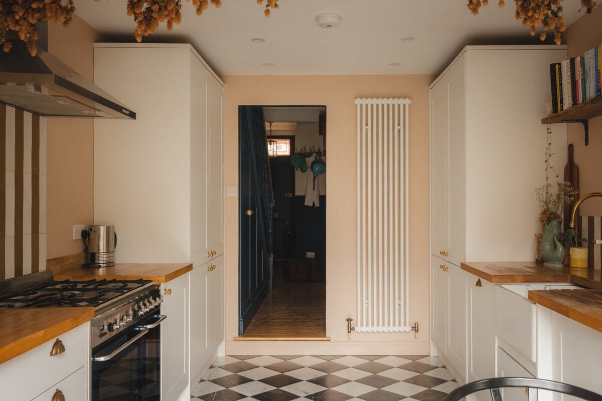 A Charming Victorian House with a Lovely Kitchen 4 kitchen with black and white checkerboard floor wooden worktop
