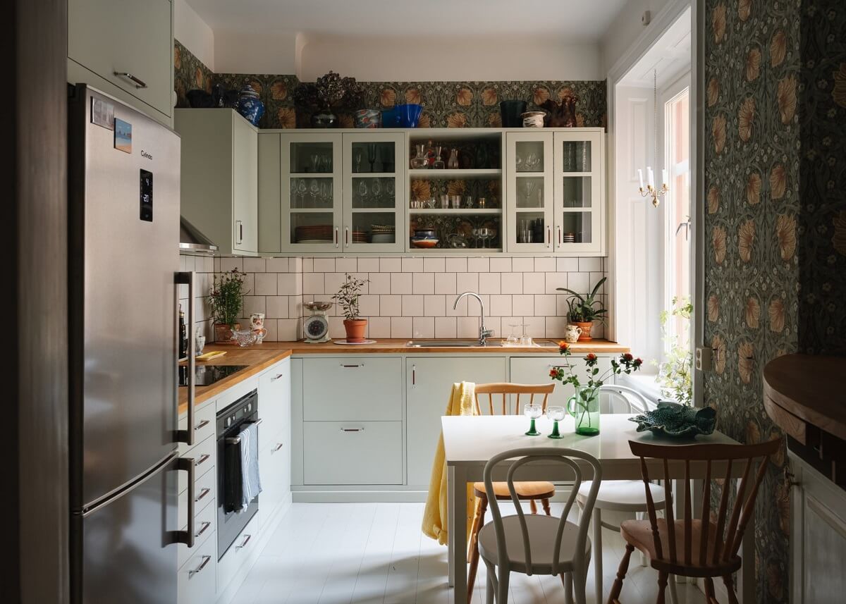 kitchen with light green cabinets and william morris pimpernel wallpaper nordroom