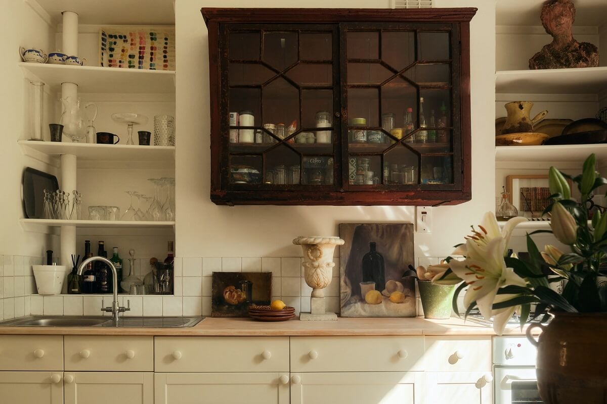 A One-Bedroom Maisonette with a Garden in London 7 kitchen with shelves and glass cabinets