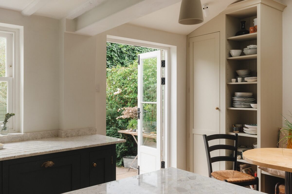 A Soft and Natural Color Palette in a Victorian Home 6 kitchen with small table and garden door
