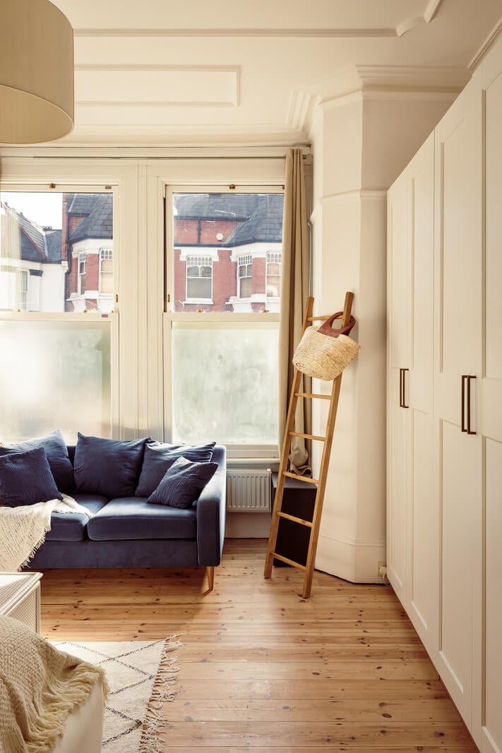A Warm Ground Floor Apartment with Reclaimed Materials 18 light bedroom with sofa and wooden floor