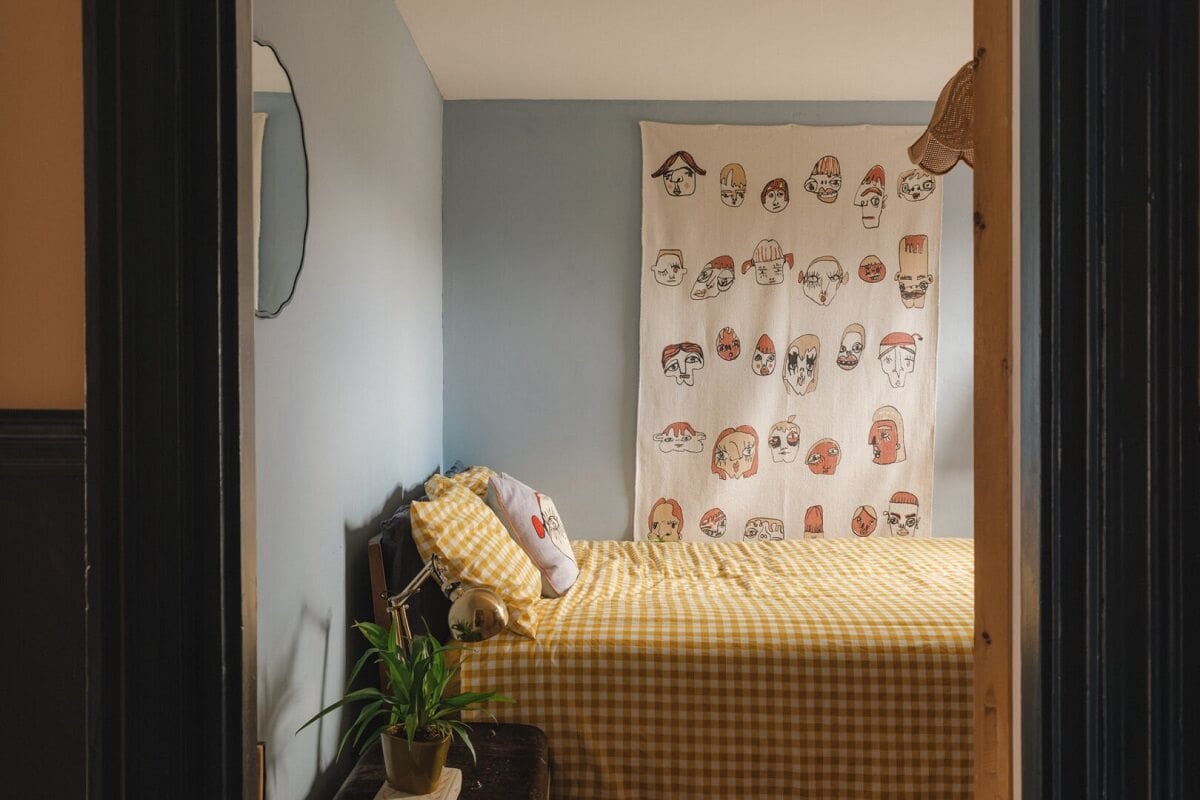 A Charming Victorian House with a Lovely Kitchen 16 light blue bedroom yellow bedding