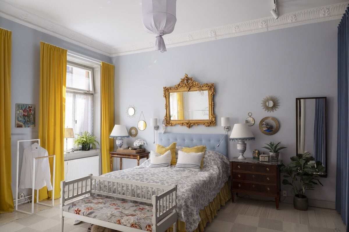 Bright, Spacious Rooms in a Classic Stockholm Apartment 15 light blue bedroom yellow curtains