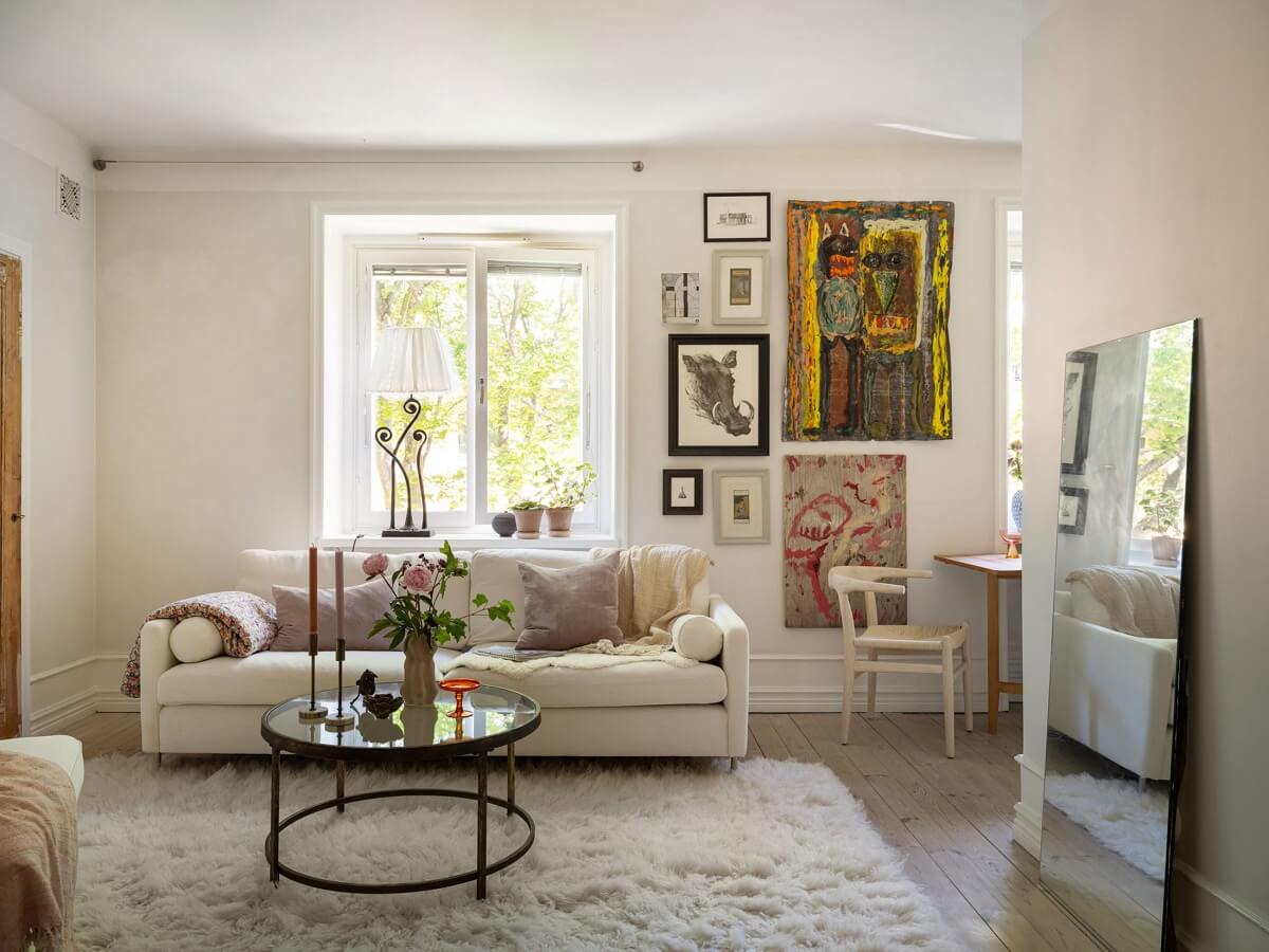 A Light and Well-Planned Apartment in Stockholm 5 light living room with gallery wall