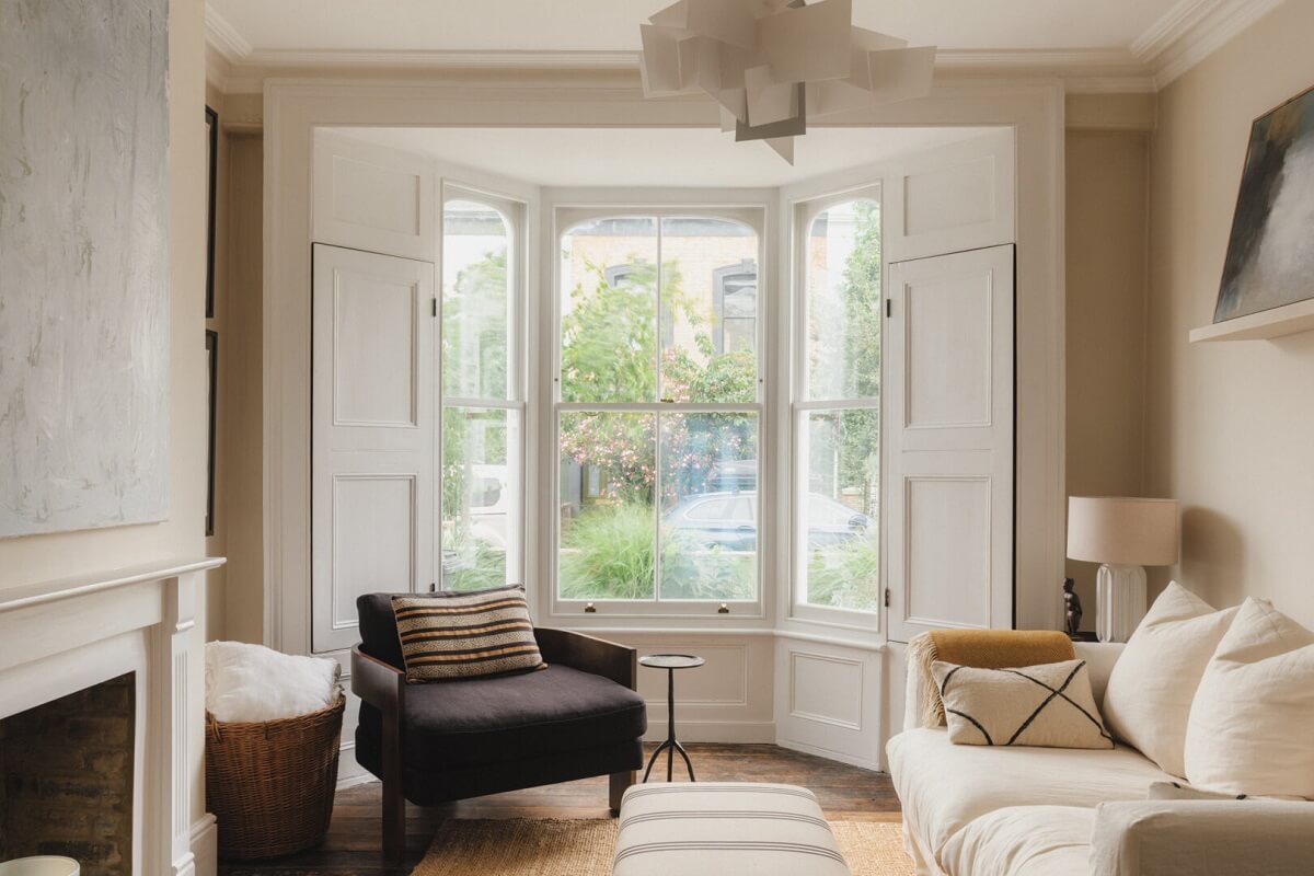 A Soft and Natural Color Palette in a Victorian Home 1 light neutral living room with large bay window