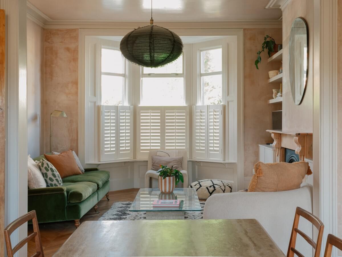 An English House with Carefully Restored Period Features 1 living room bay window plaster pink walls green sofa
