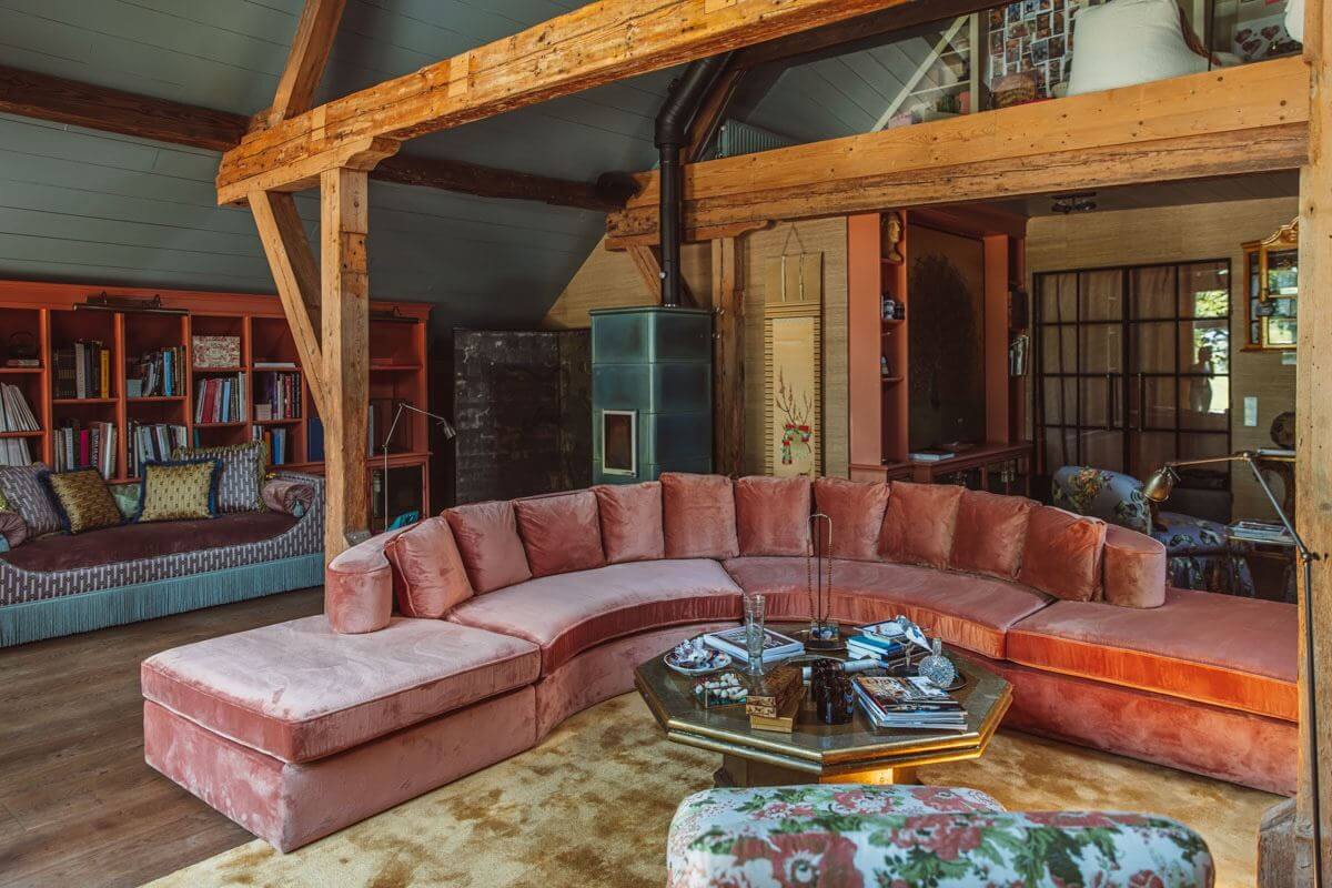 An Eclectic Colorful House in an Old Dutch Farmhouse 18 living room exposed wooden beams pink sofa