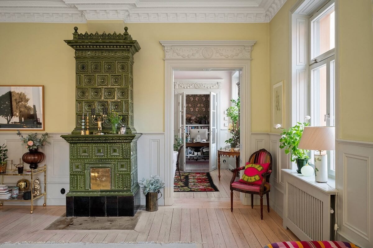 Bright, Spacious Rooms in a Classic Stockholm Apartment 5 living room green fireplace
