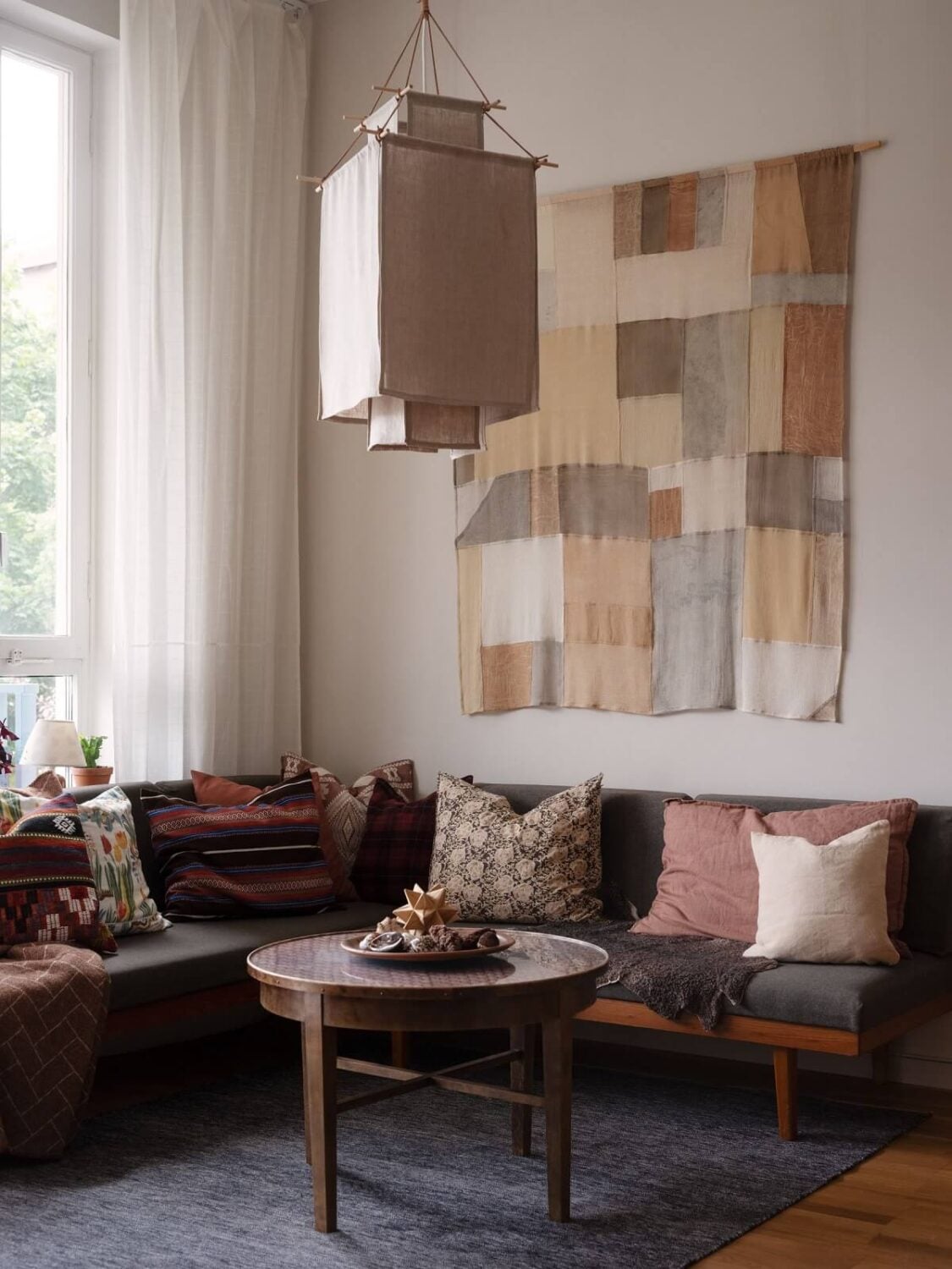 A Scandinavian Family Apartment with a Rusty Red Kitchen 3 living room with corner sofa