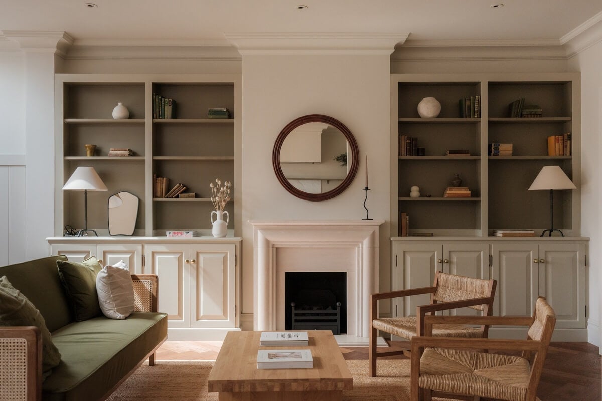 A Calm Color Palette and Warm Materials in a London Home 5 living room with fireplace and built in bookcases