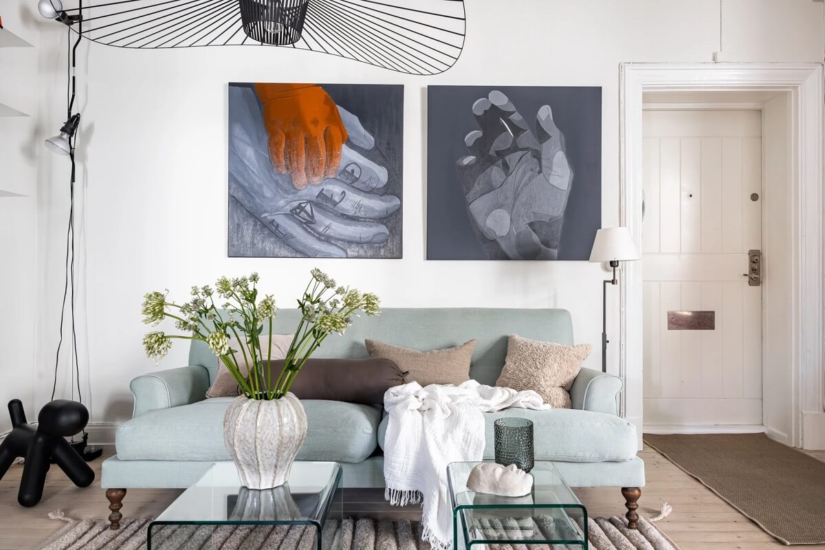 A Swedish Apartment with a Moody Kitchen and Bedroom 3 living room with light blue sofa