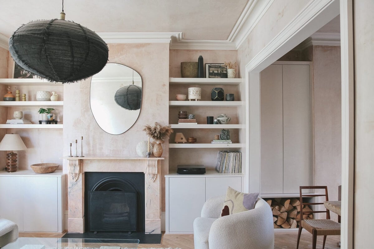 An English House with Carefully Restored Period Features 4 living room with light pink plaster walls fireplace and shelves