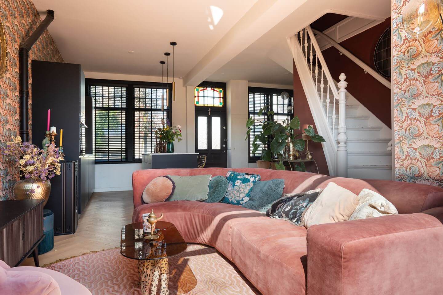 Rich Colors in a Charming Late 19th-Century Home in The Netherlands 5 living room with pink curved sofa