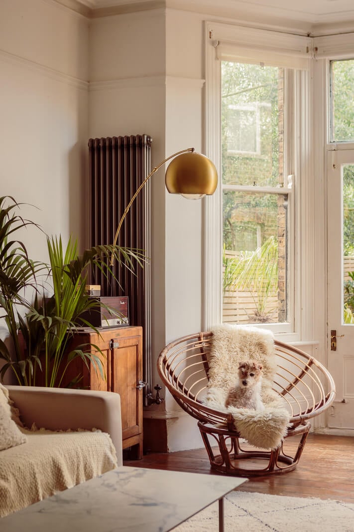 A Warm Ground Floor Apartment with Reclaimed Materials 3 living room with round rattan chair
