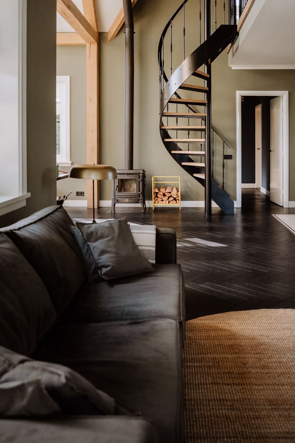 Historic Charm in a New Country House in The Netherlands 7 living room with spiral staircase